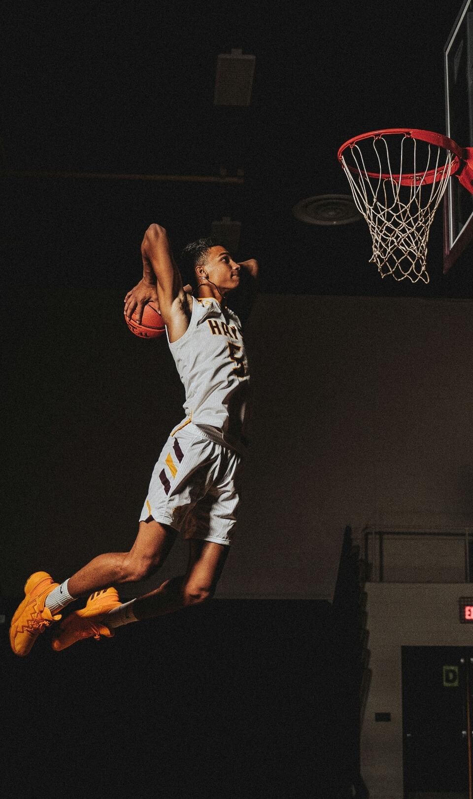 Basketball player mid-game