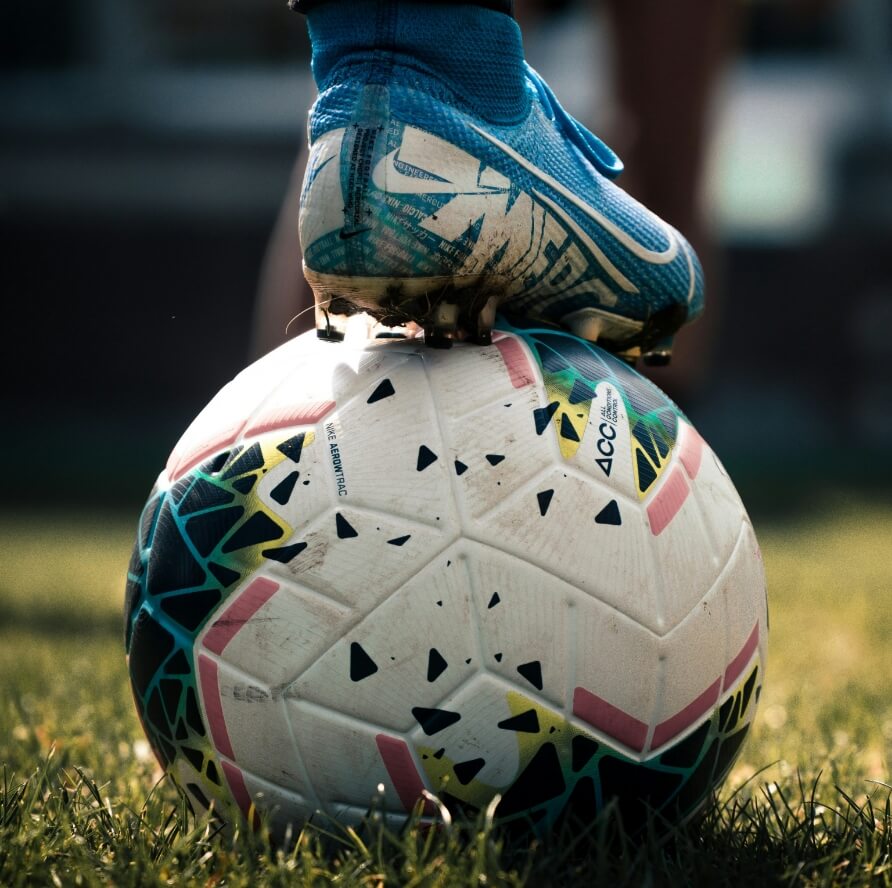 Football resting on the grass